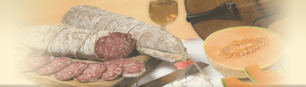 Salame affettato, coltello, vino, melone e violino